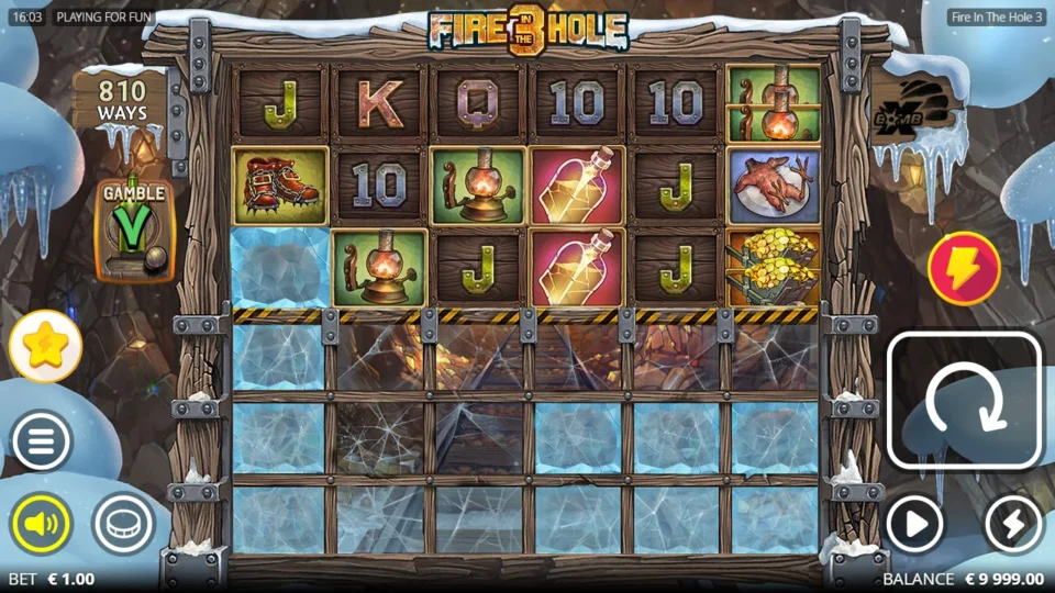 Fire in the Hole 3: Base reels of the mine at a EUR 1.00 bet with 810 ways open, the Gamble lever beside them and three rows of ice below