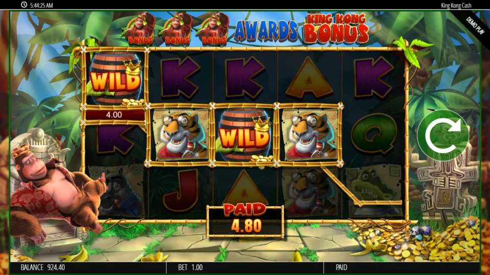 King Kong Cash: Wild barrels on reels 1 and 3 join two tigers in a line marked 4.00 as the PAID box counts up