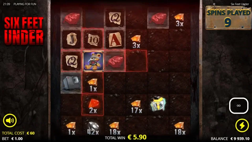 Six Feet Under: A Teddy Bear Bomb on reel 2 marks a cross over a 1x and a 2x gem on bought spin 9, other gems at 1x to 42x and EUR 5.90 in TOTAL WIN